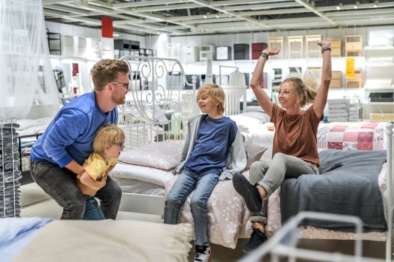 Family jumping on bed